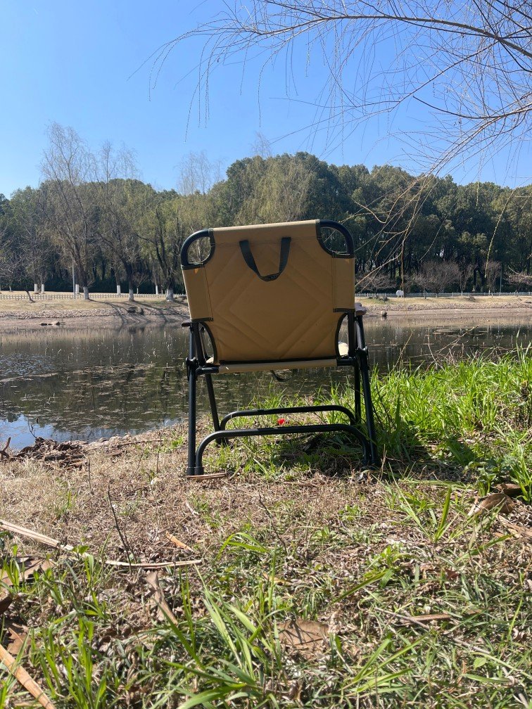 In spring, the water in the small river begins to increase, and Kemet chair's back is affected was displayed by the camping chair supplier - Nanjing Top Leisure Product Co. Ltd by the small river next to the Olympic Technology Center