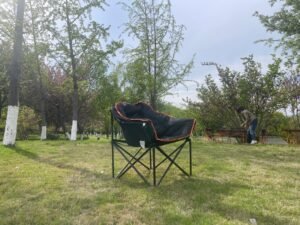 Wholesale padded moon chair, thickened folding camping chair with orange trim